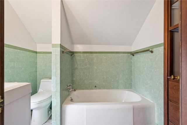 1727 Grande Ave SE, Cedar Rapids, IA 52403 - full bathroom featuring vaulted ceiling, tile walls, and vanity