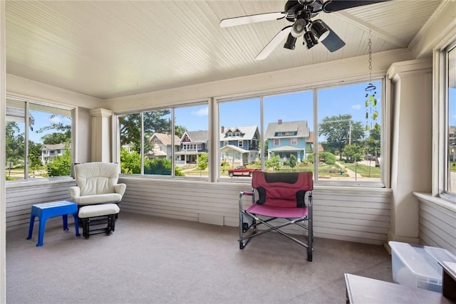 1727 Grande Ave SE, Cedar Rapids, IA 52403 - sunroom with a ceiling fan, plenty of natural light, and a residential view