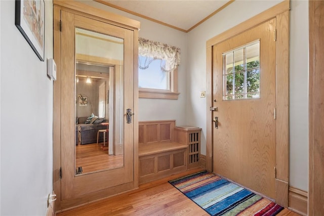 1727 Grande Ave SE, Cedar Rapids, IA 52403 - entryway featuring wood finished floors and crown molding