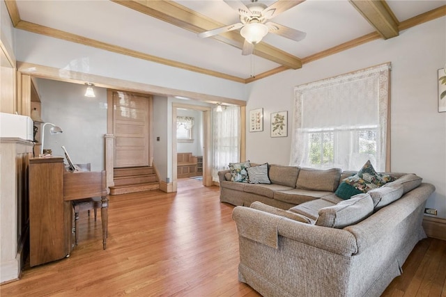 1727 Grande Ave SE, Cedar Rapids, IA 52403 - living room featuring light wood-type flooring, ceiling fan, stairway, beamed ceiling, and crown molding