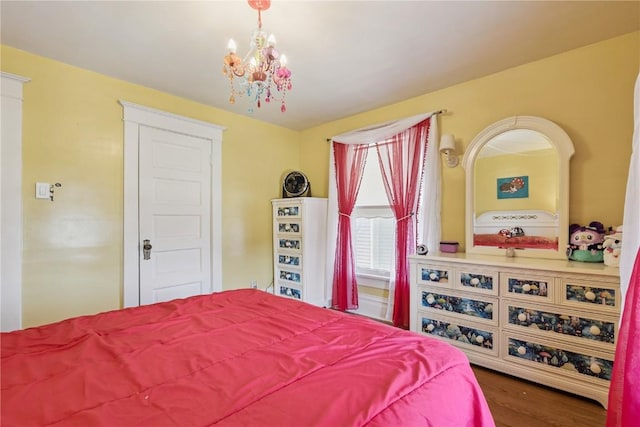 1727 Grande Ave SE, Cedar Rapids, IA 52403 - bedroom featuring a chandelier and wood finished floors