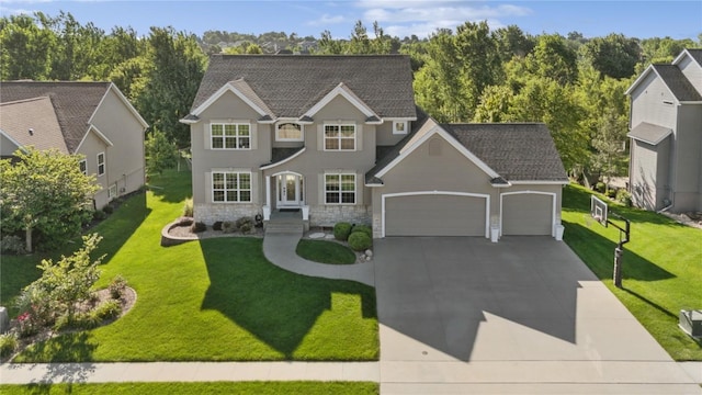 3037 Brookfield Dr, Marion, IA 52302 - view of front facade featuring an attached garage, driveway, a front lawn, and a shingled roof
