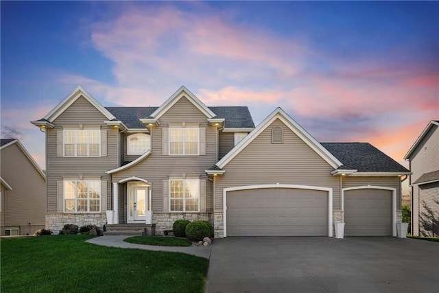 3037 Brookfield Dr, Marion, IA 52302 - traditional home featuring stone siding, concrete driveway, a yard, and a garage