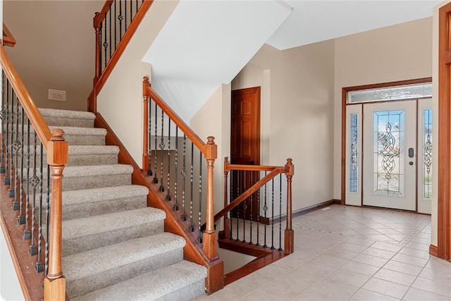 3037 Brookfield Dr, Marion, IA 52302 - foyer entrance with stairway and light tile patterned floors