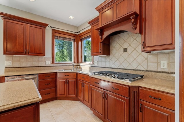 3037 Brookfield Dr, Marion, IA 52302 - kitchen with appliances with stainless steel finishes, light tile patterned flooring, tasteful backsplash, brown cabinetry, and recessed lighting