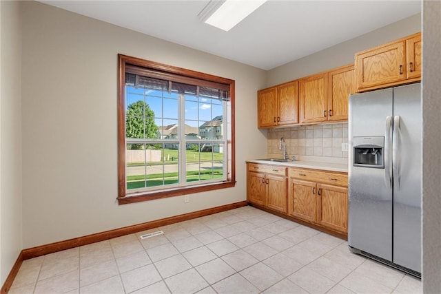 3037 Brookfield Dr, Marion, IA 52302 - kitchen with stainless steel refrigerator with ice dispenser, light countertops, and tasteful backsplash