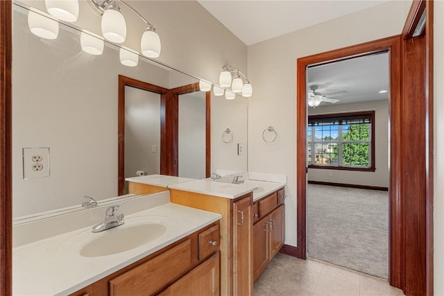 3037 Brookfield Dr, Marion, IA 52302 - bathroom featuring two vanities, tile patterned flooring, and a ceiling fan
