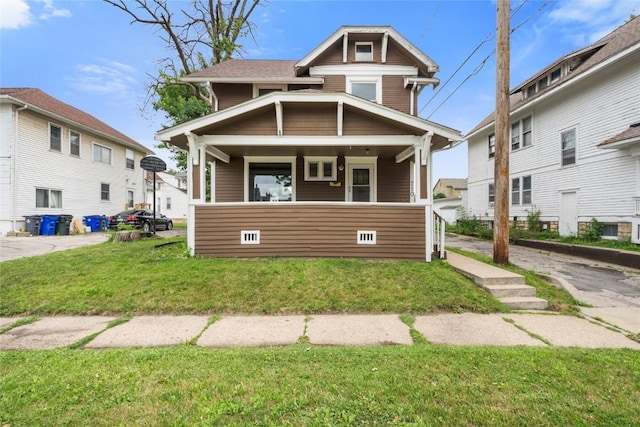 210 16th St SE, Cedar Rapids, IA 52403 - view of front of house featuring covered porch and a front lawn