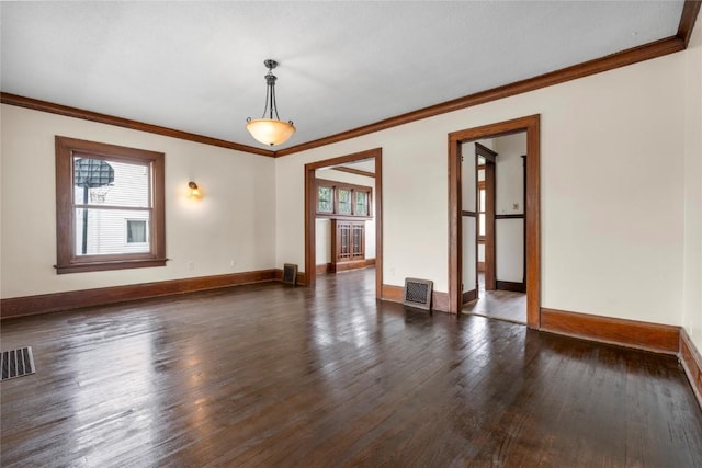 210 16th St SE, Cedar Rapids, IA 52403 - spare room with dark wood finished floors and crown molding