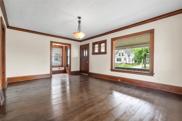 210 16th St SE, Cedar Rapids, IA 52403 - unfurnished room with dark wood-style flooring and crown molding