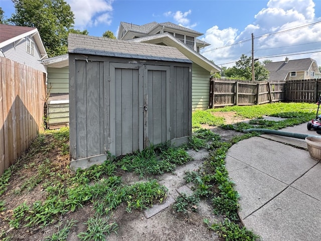 383 21st St SE, Cedar Rapids, IA 52403 - view of shed with a fenced backyard