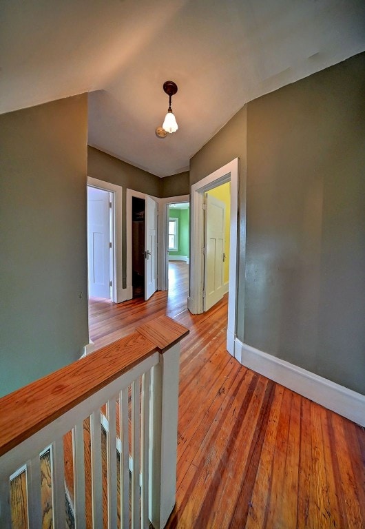 383 21st St SE, Cedar Rapids, IA 52403 - corridor featuring baseboards and light wood-style floors