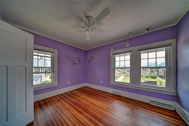 383 21st St SE, Cedar Rapids, IA 52403 - spare room with hardwood / wood-style floors and a ceiling fan