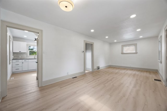 609 34th St NE, Cedar Rapids, IA 52402 - empty room with plenty of natural light, recessed lighting, and light wood finished floors