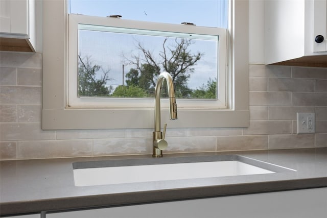 609 34th St NE, Cedar Rapids, IA 52402 - kitchen view of white cabinets and decorative backsplash