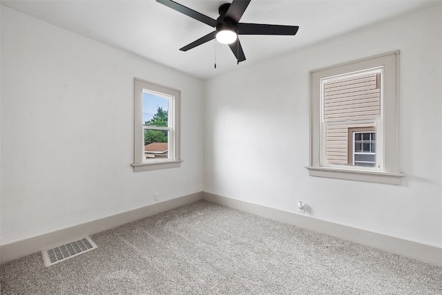 609 34th St NE, Cedar Rapids, IA 52402 - spare room with carpet flooring and ceiling fan