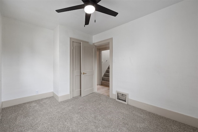 609 34th St NE, Cedar Rapids, IA 52402 - empty room featuring ceiling fan and light carpet