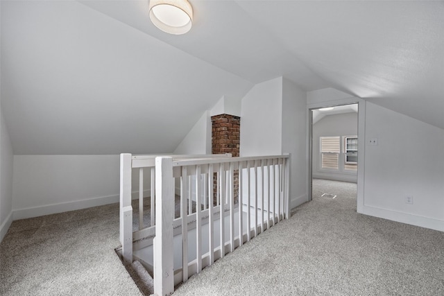 609 34th St NE, Cedar Rapids, IA 52402 - additional living space featuring carpet floors and lofted ceiling