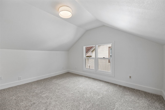 609 34th St NE, Cedar Rapids, IA 52402 - bonus room featuring carpet and lofted ceiling