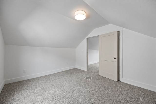 609 34th St NE, Cedar Rapids, IA 52402 - additional living space with carpet and vaulted ceiling