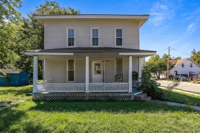 205 E Main St, Lisbon, IA 52253 - view of front of home featuring a porch and a front yard