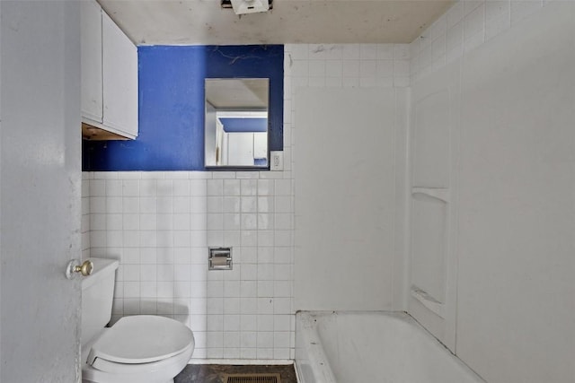 205 E Main St, Lisbon, IA 52253 - full bathroom featuring tile walls and a tub