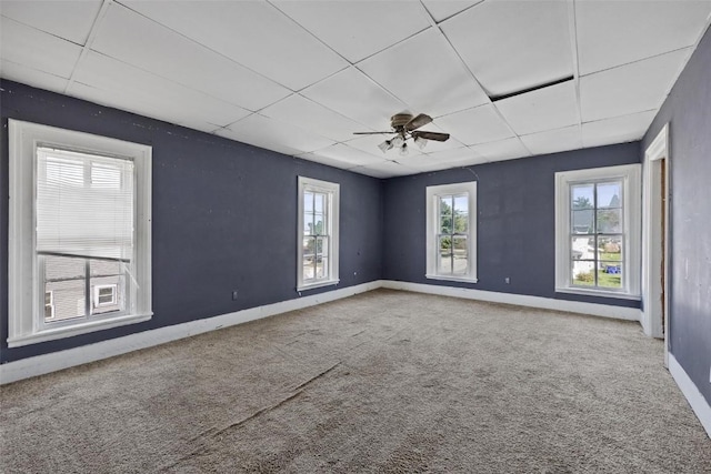 205 E Main St, Lisbon, IA 52253 - spare room with a paneled ceiling, carpet, and a ceiling fan