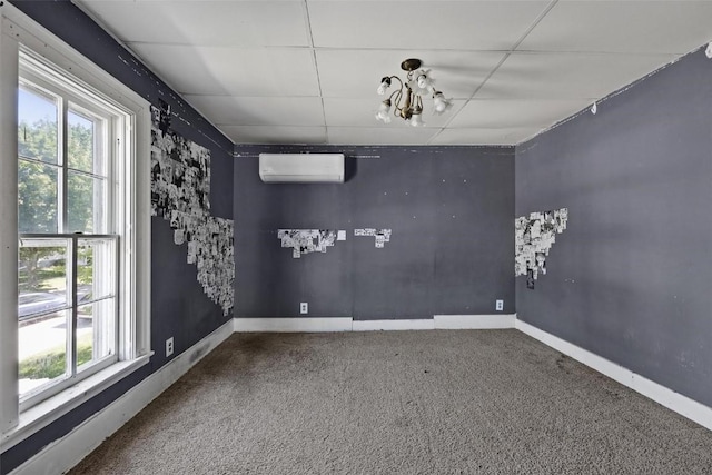 205 E Main St, Lisbon, IA 52253 - carpeted spare room featuring a wall mounted air conditioner and baseboards
