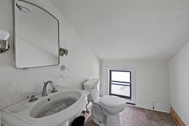 205 E Main St, Lisbon, IA 52253 - bathroom featuring a sink and toilet