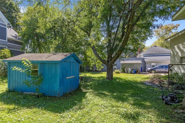 205 E Main St, Lisbon, IA 52253 - view of green lawn featuring a storage unit