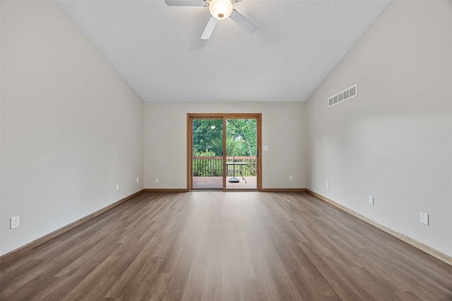 265 Parkview Ct, North Liberty, IA 52317 - unfurnished room featuring wood finished floors, lofted ceiling, and ceiling fan