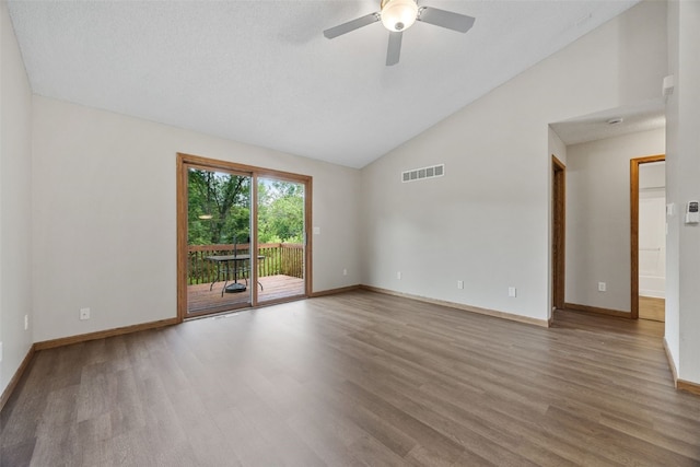 265 Parkview Ct, North Liberty, IA 52317 - empty room featuring wood finished floors, a ceiling fan, and high vaulted ceiling