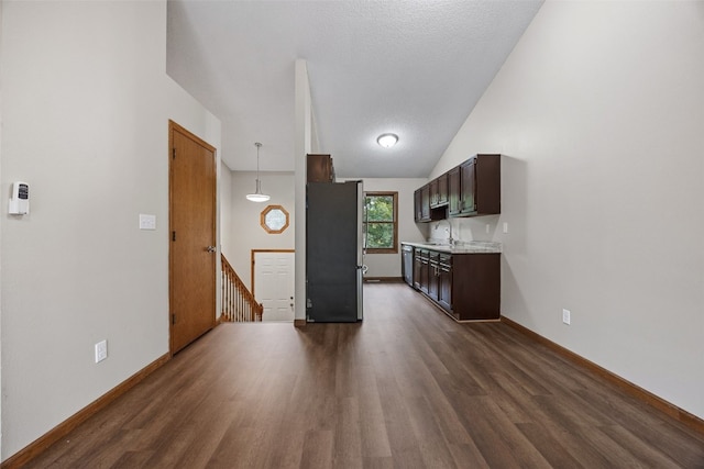 265 Parkview Ct, North Liberty, IA 52317 - kitchen featuring appliances with stainless steel finishes, light countertops, dark wood finished floors, and dark brown cabinets