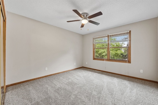 265 Parkview Ct, North Liberty, IA 52317 - unfurnished room featuring carpet floors, ceiling fan, and a textured ceiling