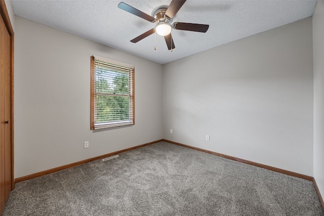 265 Parkview Ct, North Liberty, IA 52317 - carpeted spare room with a ceiling fan and a textured ceiling