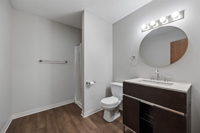 265 Parkview Ct, North Liberty, IA 52317 - full bath with vanity, wood finished floors, and a textured ceiling