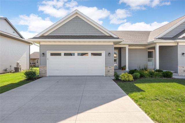 780 Brook Ridge Ave, North Liberty, IA 52317 - craftsman-style house with a front lawn, concrete driveway, an attached garage, and a shingled roof