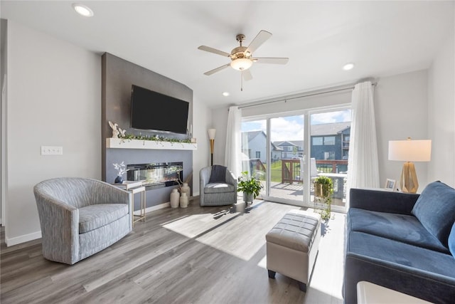 780 Brook Ridge Ave, North Liberty, IA 52317 - living area with wood finished floors, a ceiling fan, recessed lighting, and lofted ceiling