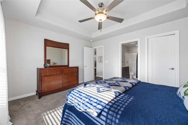780 Brook Ridge Ave, North Liberty, IA 52317 - bedroom featuring a raised ceiling, carpet floors, ensuite bathroom, and a ceiling fan