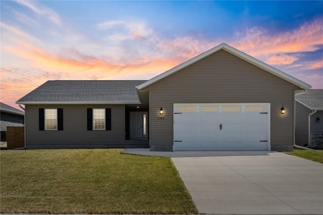 2903 Belle St SW, Cedar Rapids, IA 52404 - view of front of property with an attached garage, concrete driveway, and a front yard
