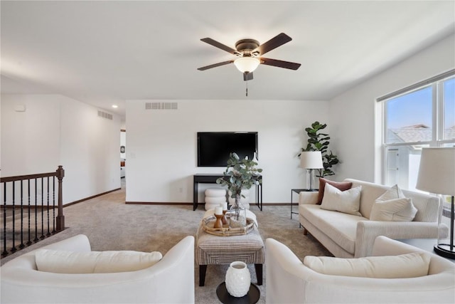 2903 Belle St SW, Cedar Rapids, IA 52404 - carpeted living room with a ceiling fan and baseboards