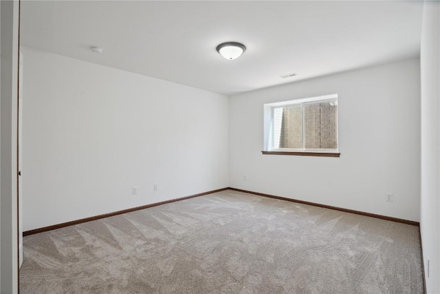 2903 Belle St SW, Cedar Rapids, IA 52404 - carpeted empty room featuring a smoke detector and baseboards
