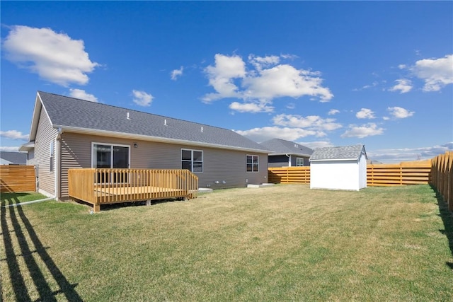 2903 Belle St SW, Cedar Rapids, IA 52404 - back of house with a deck, a fenced backyard, a shed, and roof with shingles