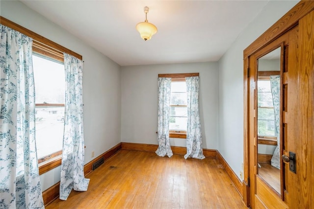 1022 19th St SE, Cedar Rapids, IA 52403 - unfurnished room with light wood finished floors and baseboards