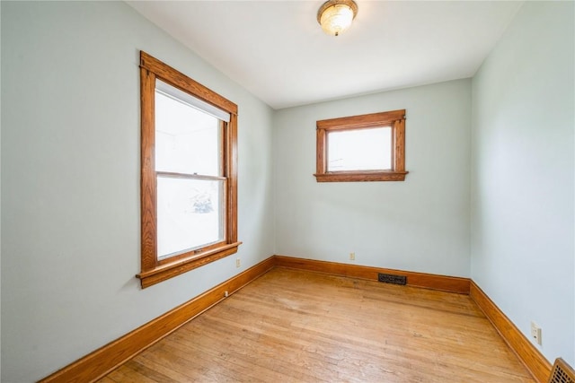1022 19th St SE, Cedar Rapids, IA 52403 - spare room with baseboards and light wood-type flooring