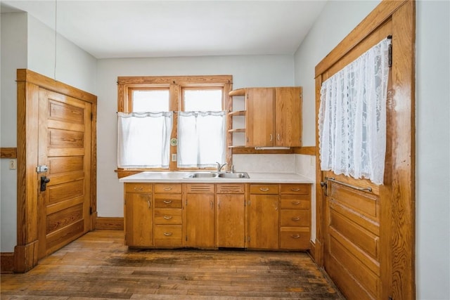 1022 19th St SE, Cedar Rapids, IA 52403 - kitchen featuring dark wood-style floors, light countertops, brown cabinetry, and open shelves