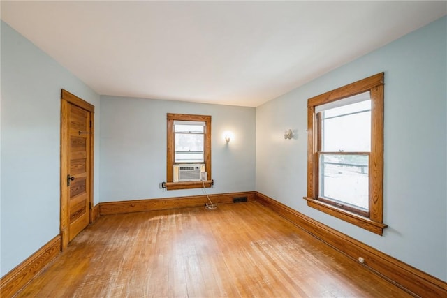 1022 19th St SE, Cedar Rapids, IA 52403 - unfurnished room with wood finished floors and cooling unit