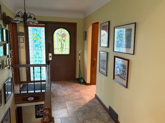 2119 Lakeview Ridge Dr NE, Solon, IA 52333 - entryway featuring a chandelier and stone finish flooring