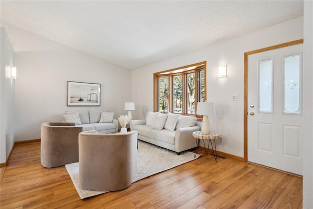 2135 Lake View Ridge Dr NE, Solon, IA 52333 - living area featuring light wood finished floors and lofted ceiling