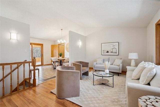 2135 Lake View Ridge Dr NE, Solon, IA 52333 - living area with light wood finished floors, lofted ceiling, and a chandelier